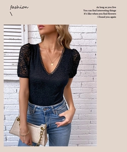 Close-up of elegant black lace bodysuit featuring intricate floral embroidery and V-neckline