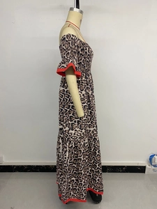 Detailed view of leopard print maxi dress featuring elegant red trim on layered ruffles