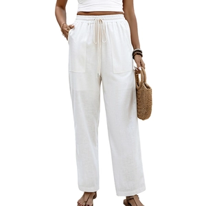 White linen wide-leg pants for women featuring a drawstring high waist and patch pockets
