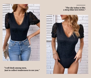 Detail of black lace bodysuit with sheer puff sleeves and elegant deep V-neckline