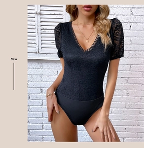 Close-up of elegant black V-neck lace bodysuit with floral patterns and scalloped edges