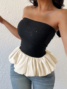 Elegant strapless black glitter top with dramatic white bubble hem for summer fashion