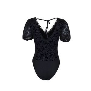 Close-up of black lace bodysuit featuring elegant V-neck and delicate floral pattern