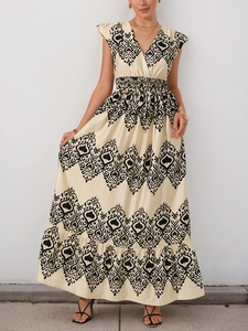 Close-up of bohemian print pattern on V-neck dress with fluttering sleeves and high waist