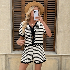 Women's black and white striped two-piece set with lace trim and tie-front top