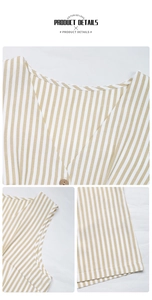 Detail of yellow vertical striped romper showing V-neck and wooden buttons