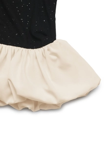 Detail of black sequined bodice with a cream bubble hem skirt for a high-contrast style