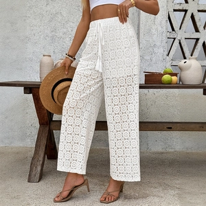 White crochet lace wide-leg pants with elastic drawstring waist and boho floral patterns