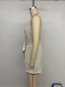 Detailed view of khaki vertical striped sleeveless V-neck romper with a matching waist tie