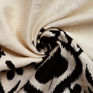 Close-up of leopard print linen blend fabric showing breathable texture and drapery