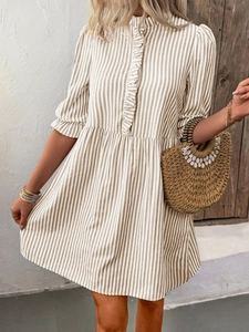Detail of ruffled collar and cuffs on khaki striped bohemian summer mini dress