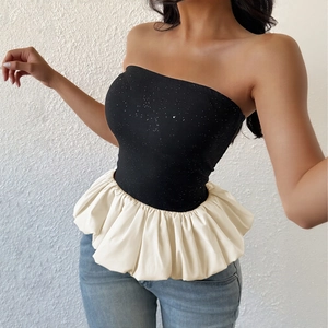 Chic black and white tube top with sequin bodice and pleated flared ruffle hemline