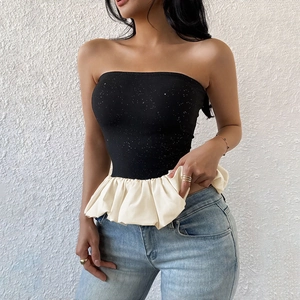 Elegant black strapless top with silver glitter accents and cream ruffled hem trim