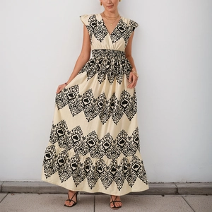 Bohemian V-neck maxi dress with vintage black print, flutter sleeves and tiered skirt