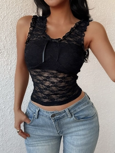 Close-up of black floral lace camisole with ruffle trim and ribbon bow detail