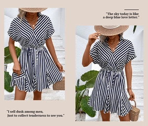 Detailed view of the striped pattern with waist tie and A-line hem on a blue summer dress
