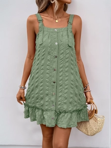 Detail of sage green textured mini dress with button front and ruffled hem design