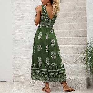 Green bohemian maxi dress with white ethnic print, V-neck, high waist, and tiered ruffle hem