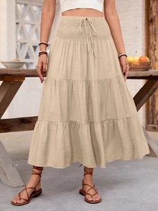 Bohemian apricot tiered A-line maxi skirt with elastic high waist and decorative drawstring