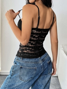 Detail of black floral lace back on women's camisole with adjustable thin straps