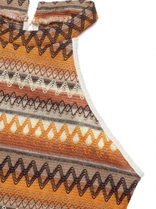 Close-up of knit halter top featuring colorful geometric wave patterns and refined stitching