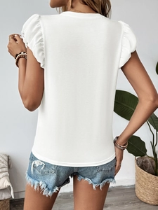 Detail of ruffled flutter sleeves on a white summer t-shirt with back view of a woman