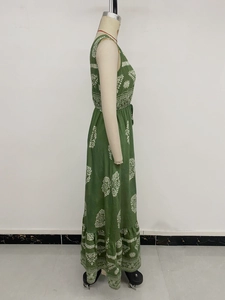 Detail of green ethnic print maxi dress featuring ruffled hem and sleeveless design