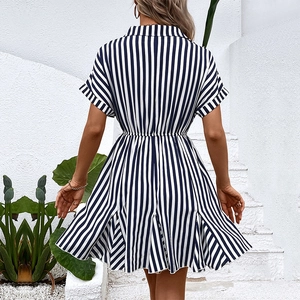 Black and white striped short-sleeve shirt dress with high waist and pleated skirt