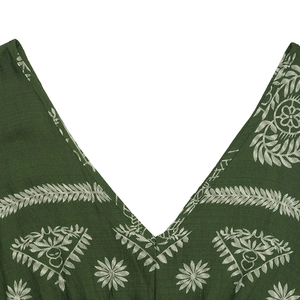 Detail of V-neckline and white ethnic floral print on dark green holiday maxi dress