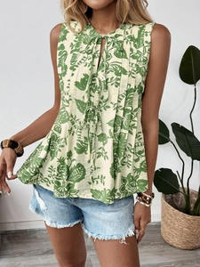 Detail view of the floral print sleeveless top with V-neck tie and pleated texture finish