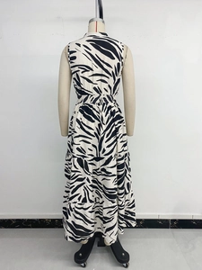 Detail view of v-neck zebra print sleeveless tiered dress with elastic waist