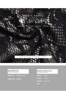 Détail du caraco en dentelle noire montrant des motifs floraux et une texture premium
