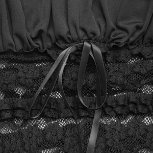 Detail of black ribbed knit fabric joined with floral lace and a satin bow decoration