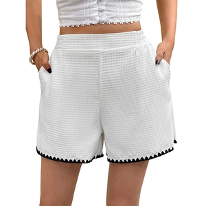 Women's white high-waist waffle knit shorts with black triangle lace trim for summer casual