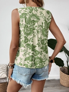 Detail of pleated back and green floral print on sleeveless cotton blouse for women