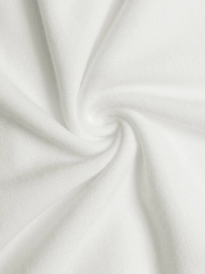 Close-up of white knitted fabric with soft texture and refined weave on women top