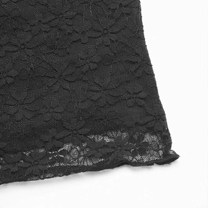 Detailed macro view of black floral lace fabric with delicate scalloped edges for women's top