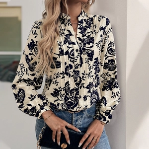 Detail of the vintage floral pattern and pleated texture on this elegant high neck shirt