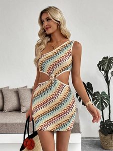 Detail of knit mini dress with waist cut-outs and golden starfish buckle accent