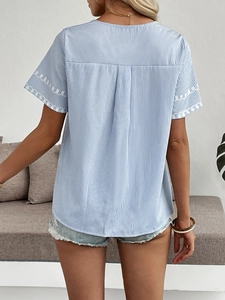 Women's V-neck blue and white striped short sleeve shirt with back pleat and embroidery