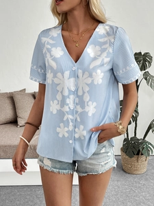 Women's light blue striped V-neck short sleeve shirt with delicate white floral embroidery