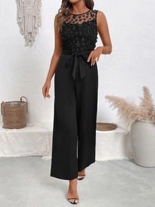 Combinaison noire élégante en dentelle avec fleurs en relief, taille haute et pantalon large