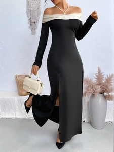Detail of elegant off-the-shoulder long sleeve dress with high slit and contrast neckline