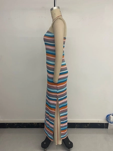 Close-up of knit colorful striped strapless dress showing high side slit and texture