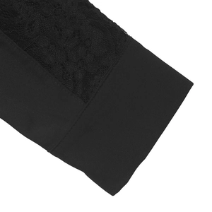 Close-up of black lace patchwork sleeves and neat stitching on a women's shirt