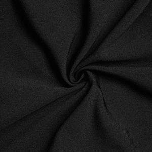 Macro detail of elegant black knitted fabric with soft texture and premium drape feel