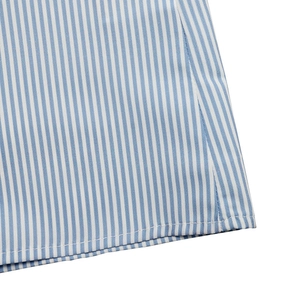 Close-up of blue and white striped shirt fabric with neat double-row stitching detail