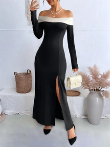 Detailed view of the off-shoulder neckline and elegant side slit on this sleek dress