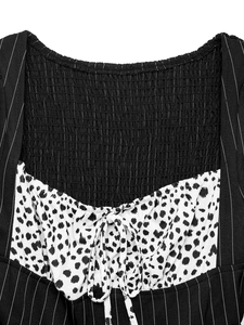 Detail of smocked texture and contrast stitching with stripes and leopard print patterns