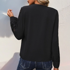 Women's black long sleeve top with lace patchwork and high collar back view